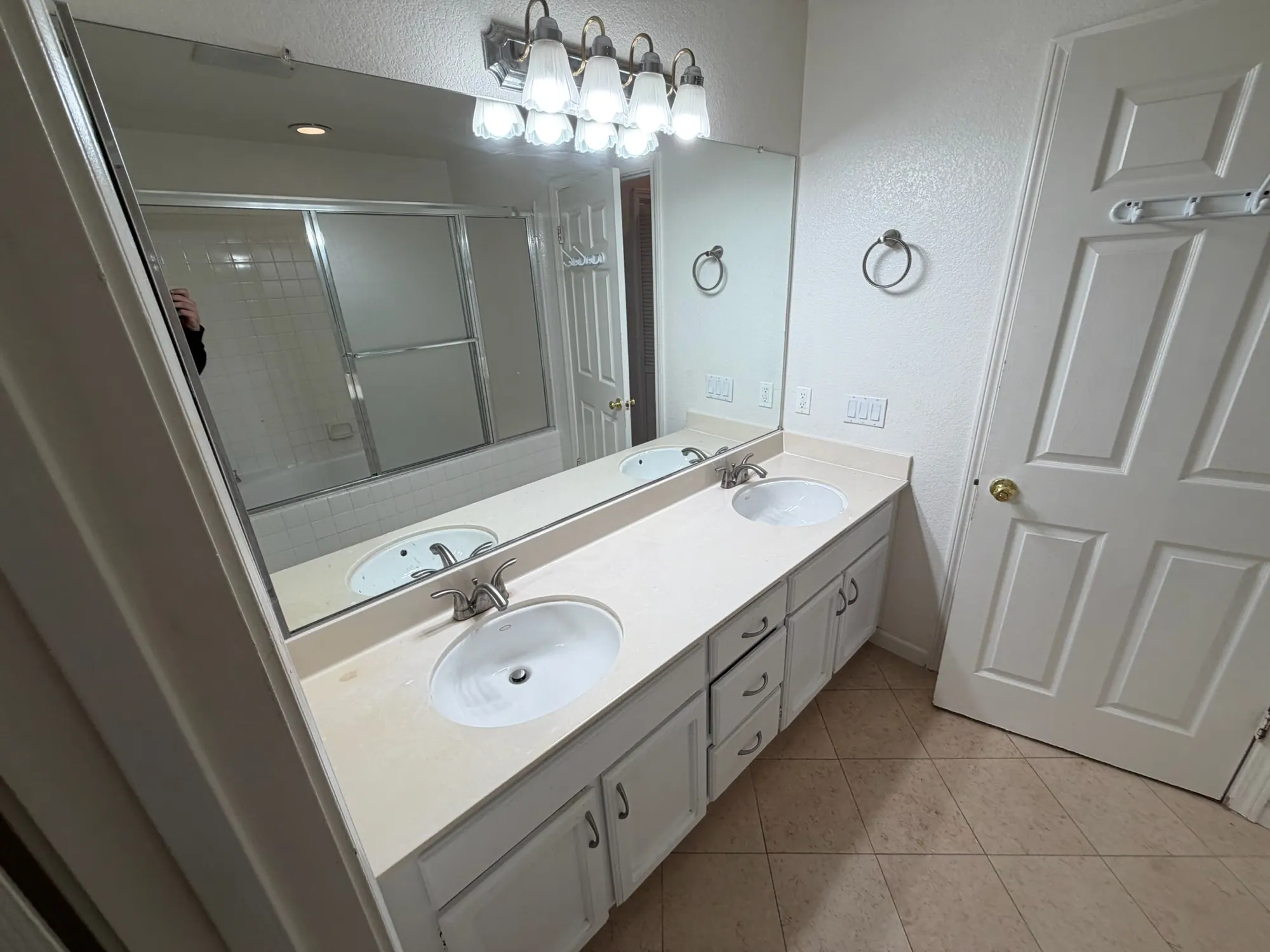 Bathroom with a double vanity and bright lighting