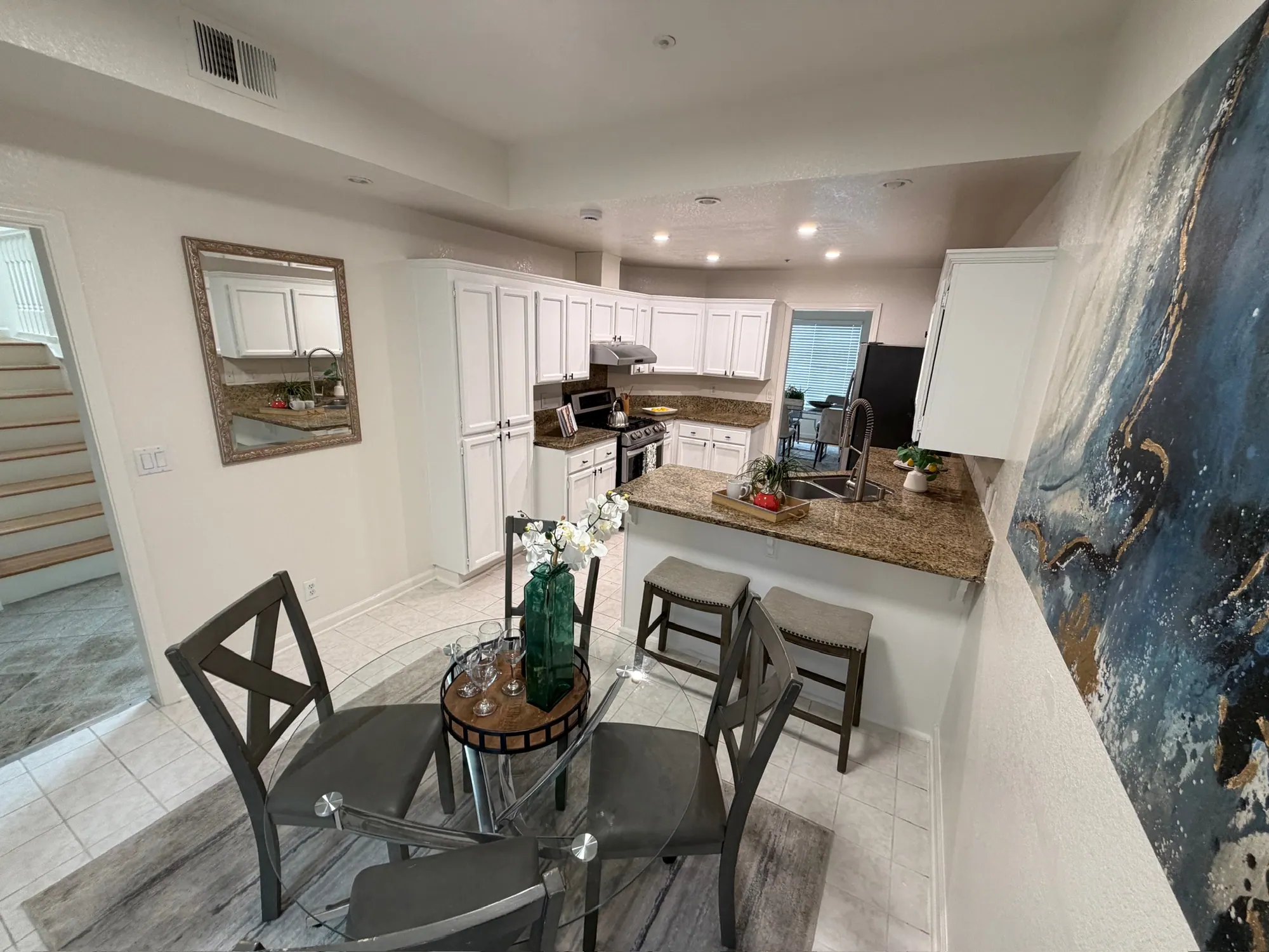 Kitchen and dining nook staged for the listing