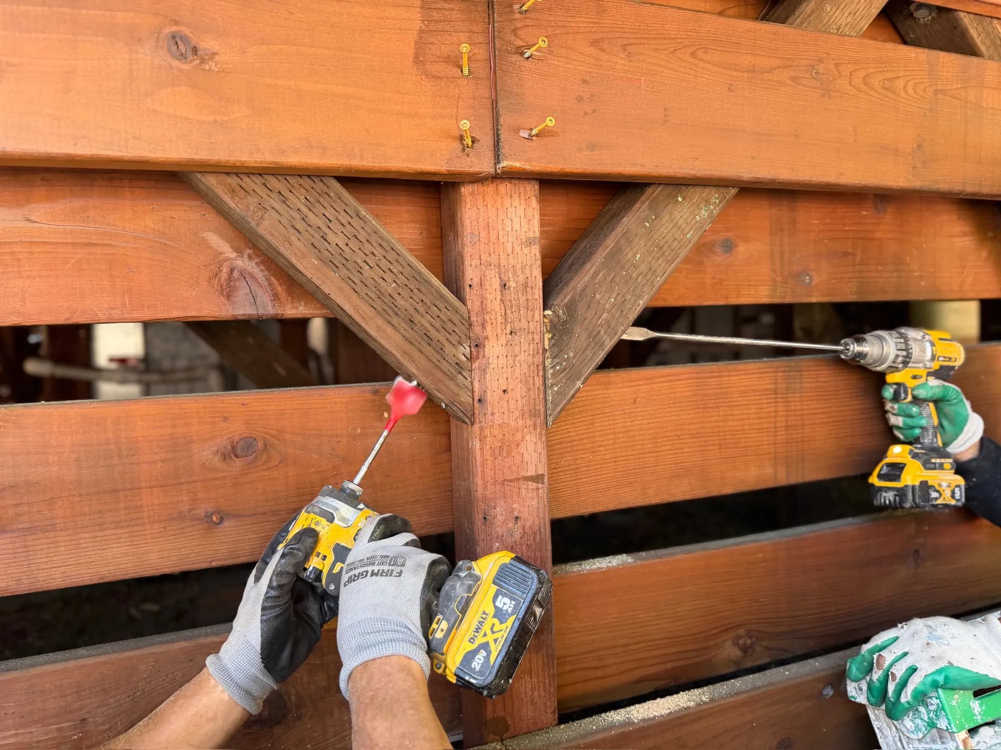 Gloved hands driving the bolts for a knee brace