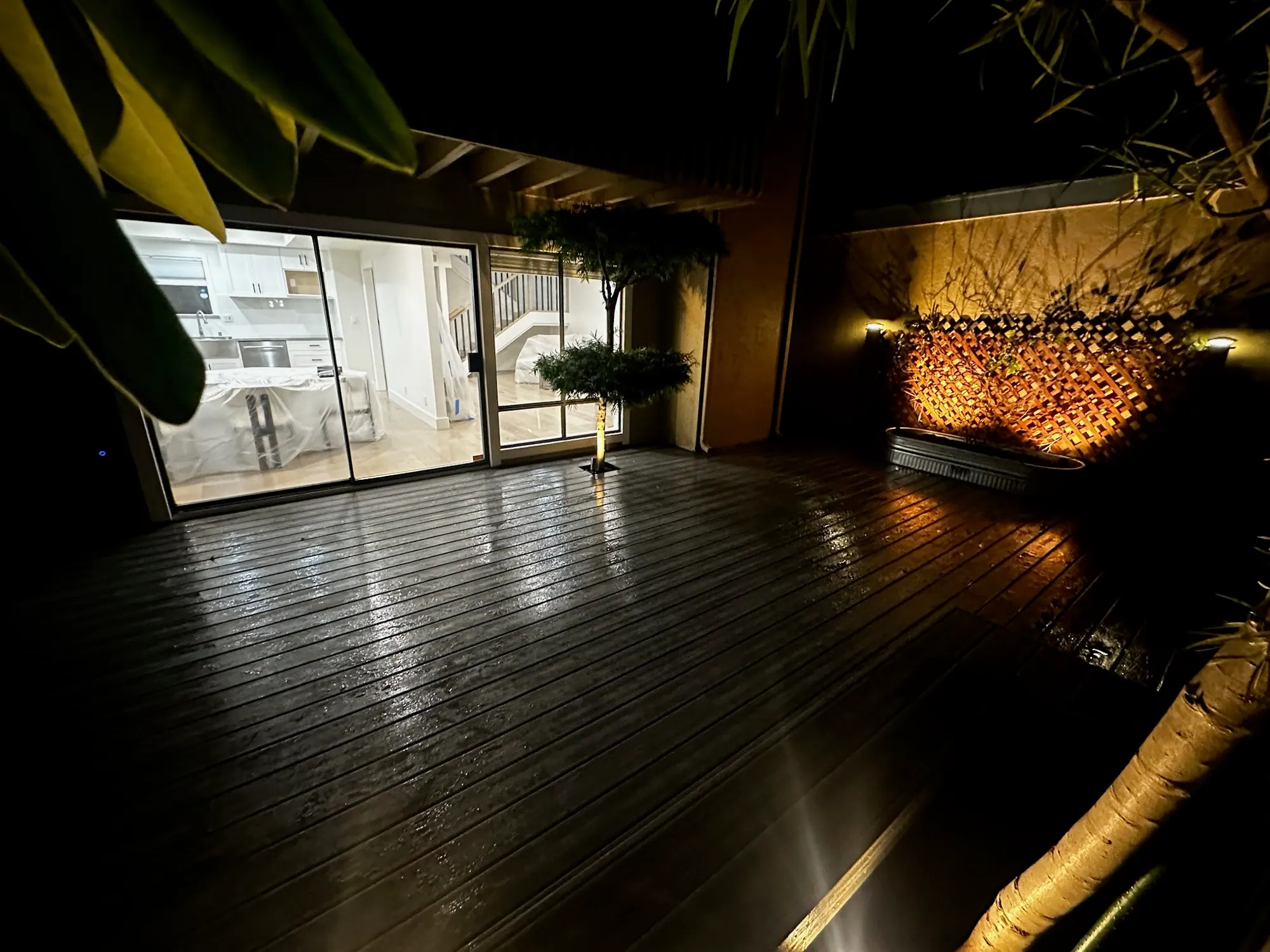 New deck at night with low-voltage landscape lighting