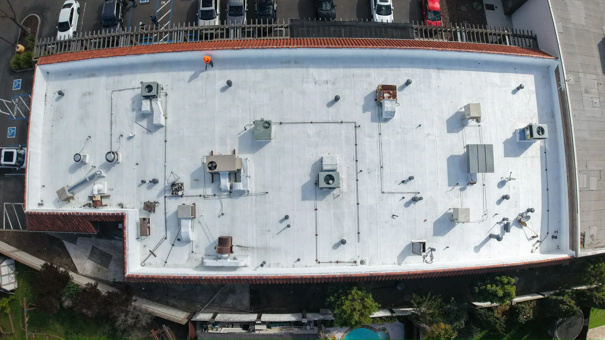 Flat retail roof from directly above after its new white coating